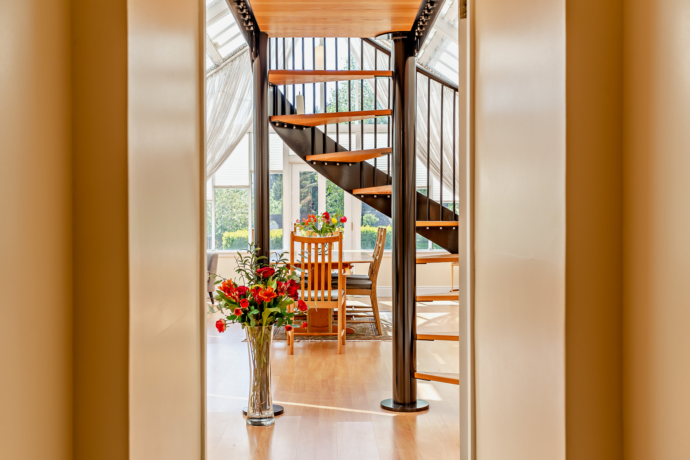 Stunning light-filled interior with a spiral staircase